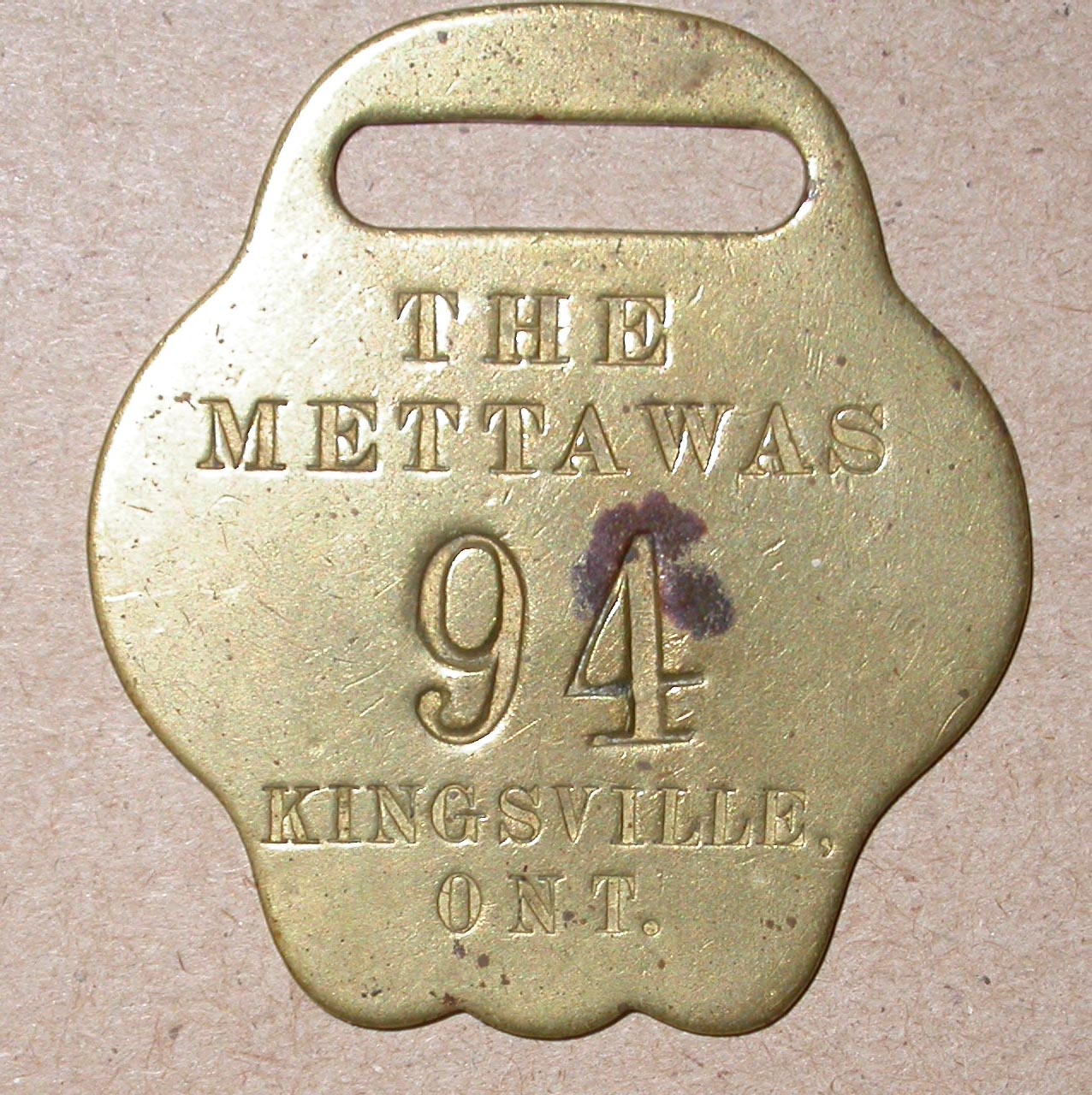 a%20gold%20tag%20for%20a%20room%20key%20from%20The%20Mettawas%20Hotel%20in%20Kingsville%2C%20Ontario
